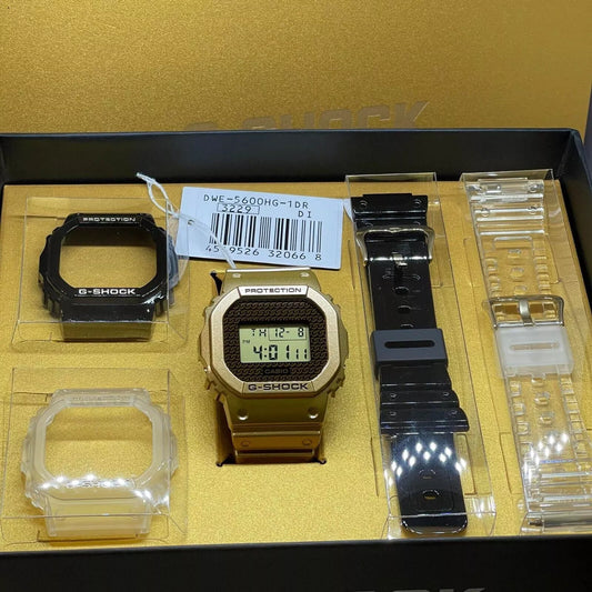 Casio G-Shock DWE-5600HG-1D Orologio con cinturino e lunetta con design a catena d'oro